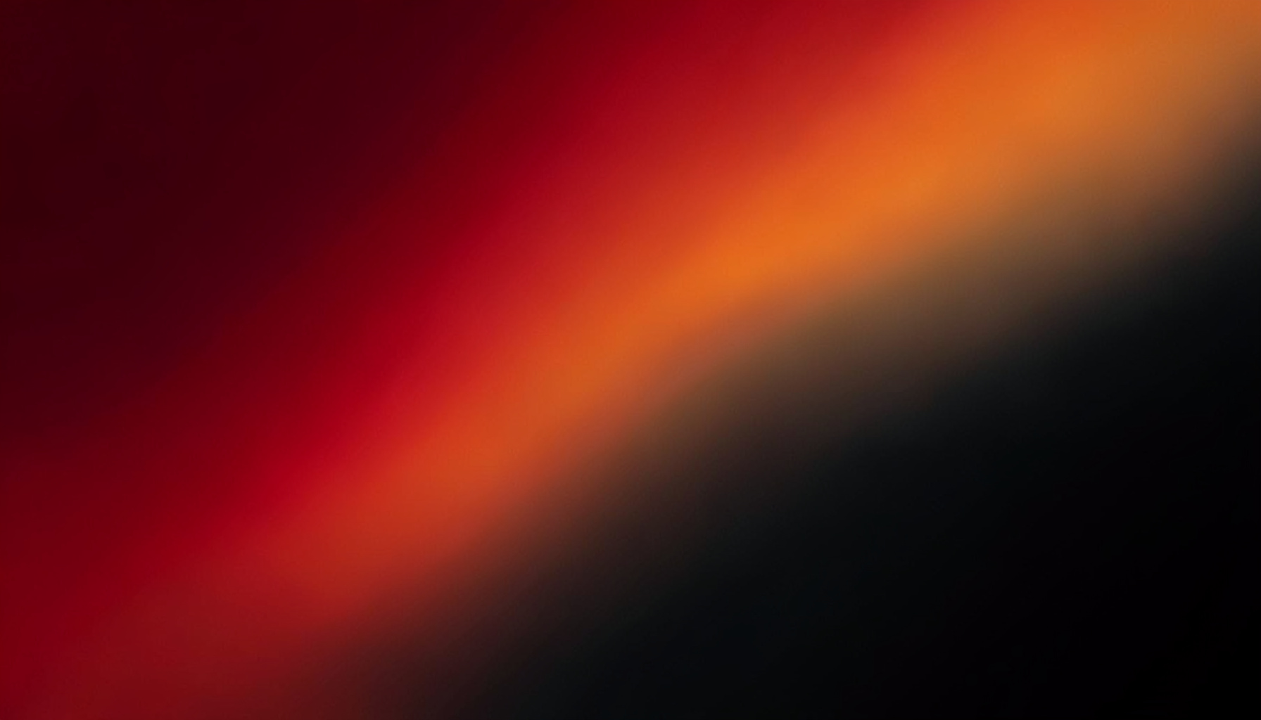 Abstract gradient composition transitioning from deep crimson through warm orange to charcoal black, moody and atmospheric