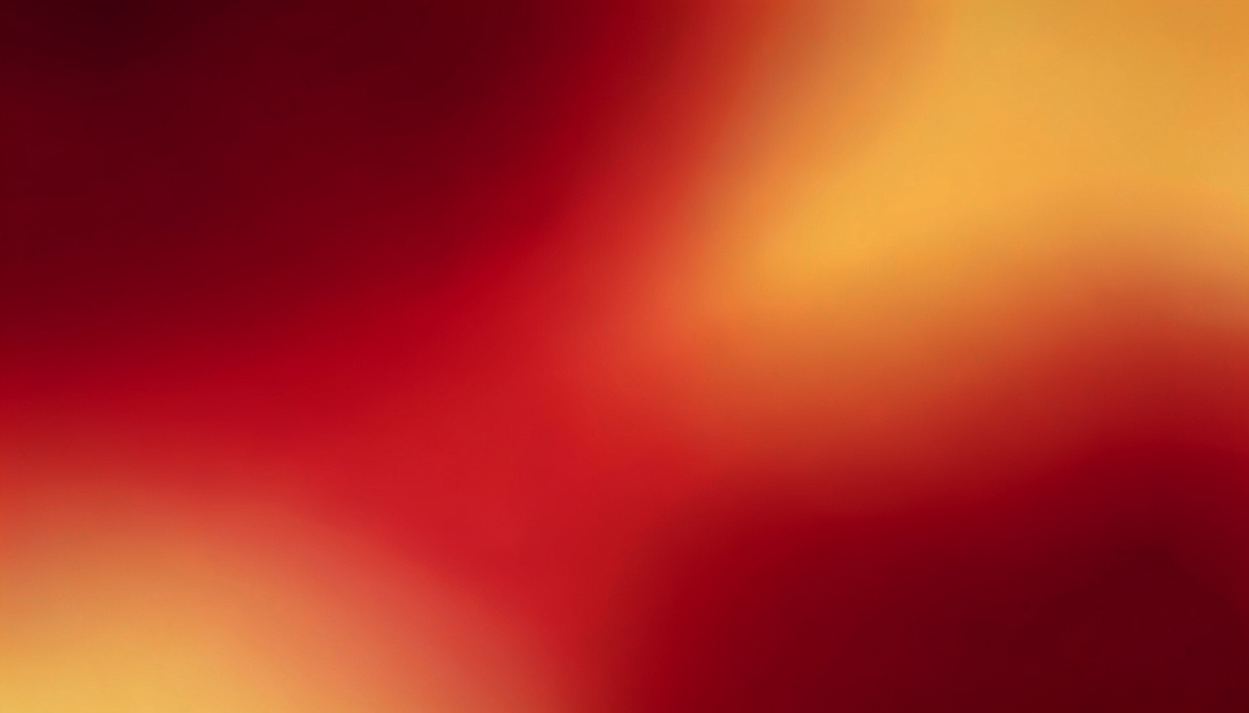 Abstract warm gradient composition blending deep crimson into golden orange, smooth and atmospheric